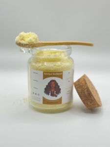 Wicked Redhead Bath Salts in glass jar with wooden spoon