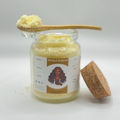Wicked Redhead Bath Salts in glass jar with wooden spoon