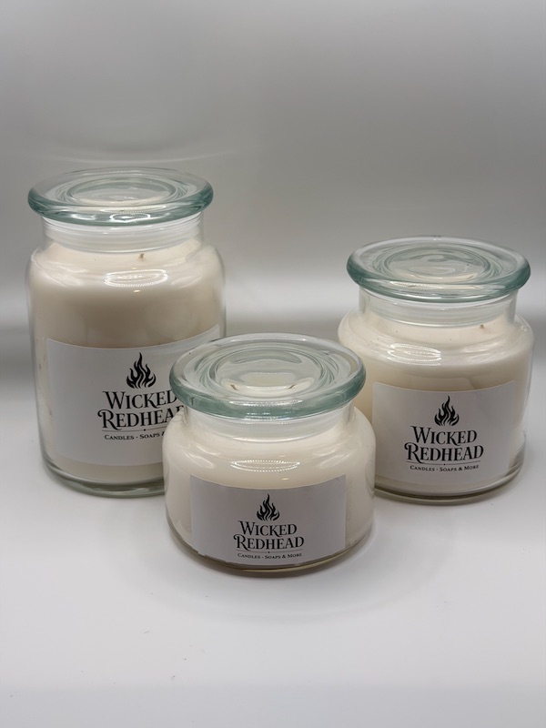 Winter Luxury Candle Collection — Wicked Redhead Handcrafted Candle & Bath Collection “Wicked Redhead luxury glass jar candles with white wax and clear glass lids displayed on a white background.
