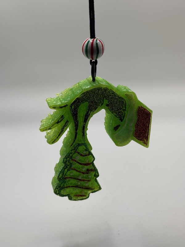 🎄 Holiday Heist™ Freshie — Wicked Redhead Handcrafted Candle & Bath Collection Green glitter hand holding Christmas tree aroma bead freshie – handmade car freshener